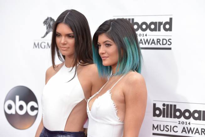 Kendall Jenner and Kylie Jenner arrive at the 2014 Billboard Music Awards at MGM Grand Garden Arena on Sunday, May 18, 2014, in Las Vegas.