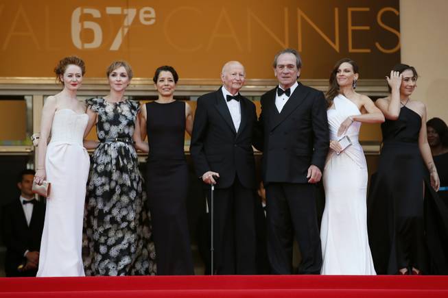 From second right, actress Hilary Swank; director Tommy Lee Jones; Cannes film festival President Gilles Jacob; the wife of Tommy Lee Jones, Dawn Laurel-Jones; actress Sonja Richter; and actress Miranda Otto stand at the top of the red carpet as they arrive for the screening of "The Homesman" at the 67th international film festival in Cannes, southern France, on Sunday, May 18, 2014.