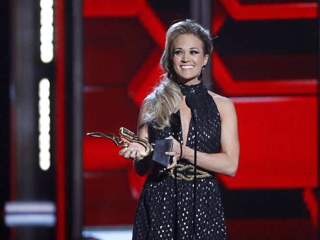 Carrie Underwood accepts the Milestone Award during the 2014 Billboard Music Awards at MGM Grand Garden Arena on Sunday, May 18, 2014, in Las Vegas.