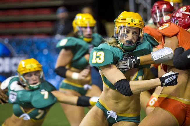 Anna Heasman, of Green Bay Chill, clashes with Kelly Campbell of the Las Vegas SIN, Thursday May 15, 2014. The SIN beat Green Bay 34 to 24 at Thomas & Mack Center, their first win of the Legends Football League season.