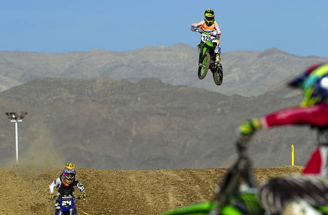 David Kartes, 17, of Las Vegas files off a jump at the Sandy Valley MX motocross course in Sandy Valley Thursday, May 15, 2014.