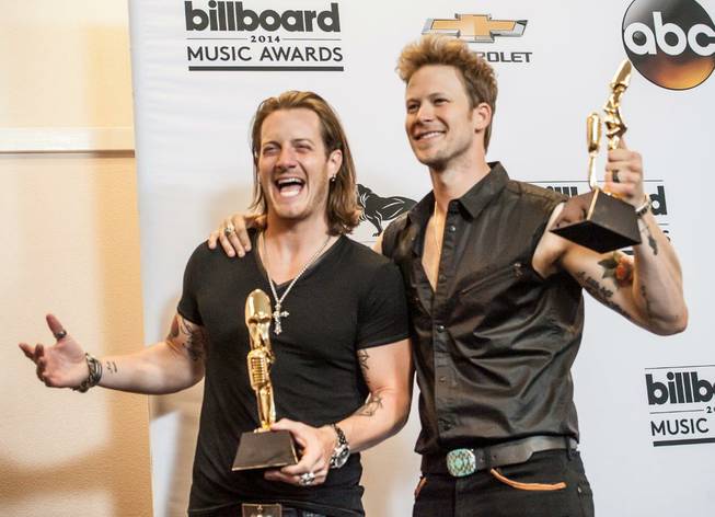 Tyler Hubbard and Brian Kelley of Florida George Line backstage in the media room of the 2014 Billboard Music Awards at MGM Grand Garden Arena on Sunday, May 18, 2014, in Las Vegas.