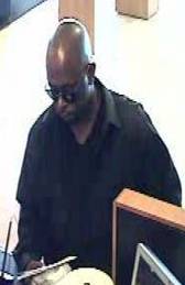 This man robbed a bank on May 13, 2014, in the area of Windmill Lane and Eastern Avenue.