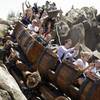 This May 16, 2014, photo shows Disney cast members testing the new Seven Dwarfs Mine Train roller coaster in the Magic Kingdom at Walt Disney World in Lake Buena Vista, Fla. The ride will be opened to park guests May 28.