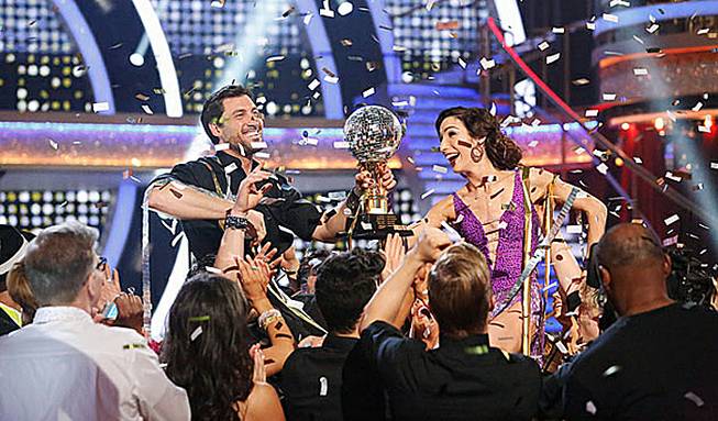 Maksim Chmerkovskiy and ice dancer Meryl Davis celebrate their Season 18 victory on ABC’s “Dancing With the Stars” on Tuesday, May 20, 2014. 