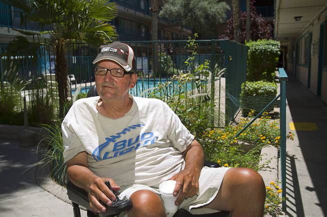 Downtown resident Joe Sennett, 59, originally from Boston, is shown in the courtyard of the Park Avenue Apartments at Seventh Street and Carson Avenue Tuesday, May 15, 2014. STEVE MARCUS