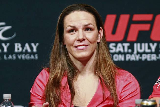 Alexis Davis smiles during a news conference to promote UFC 175 Friday, May 23, 2014 at the MGM Grand Garden Arena. UFC 175 will be held July 5th, 2014 at the Mandalay Bay Events Center.
