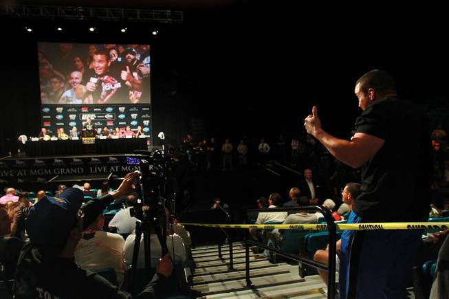Former UFC fighter Pat Berry sneaks in a final question during a news conference to promote UFC 175 Friday, May 23, 2014 at the MGM Grand Garden Arena. UFC 175 will be held July 5th, 2014 at the Mandalay Bay Events Center.