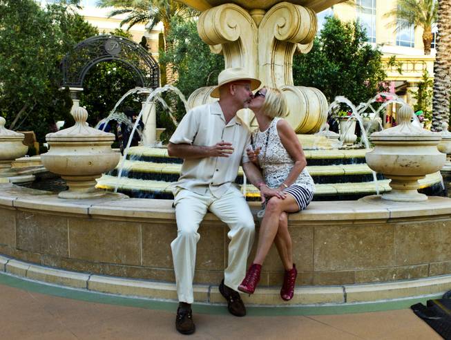 Dr. Ronald Reisch and wife Leslie share a kiss during the Epicurean Affair presented by the Nevada Restaurant Association at the Palazzo on Thursday, May 22, 2014.