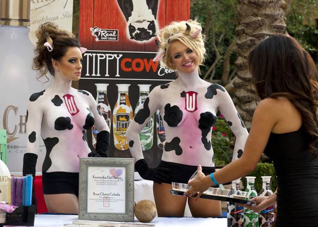 Several models painted as cows help to promote Tippy Cow Rum Cream during the Epicurean Affair presented by the Nevada Restaurant Association at the Palazzo on Thursday, May 22, 2014.