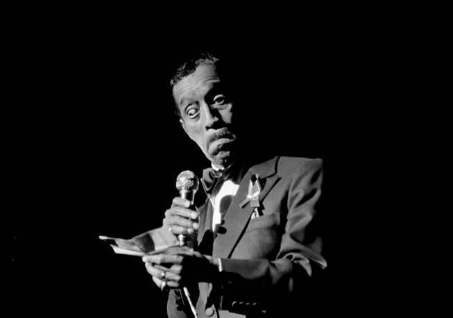 Sammy Davis Jr., reads a personal note to the audience at the opening of a benefit performance in Atlanta, March 10, 1981, to raise funds for the investigation into the deaths or disappearance of 21 Atlanta children. 