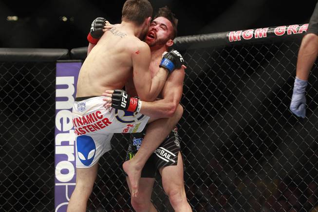 James Krause hits Jamie Varner with a knee during their fight at UFC 173 Saturday, May 24, 2014 at the MGM Grand Garden Arena. Krause won by injury TKO after Varner broke his ankle.