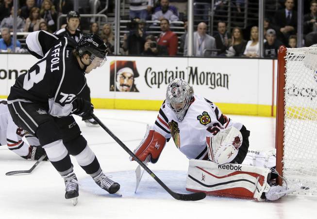 Los Angeles Kings center Tyler Toffoli scores past Chicago Blackhawks goalie Corey Crawford during the second period of Game 3 of the Western Conference finals of the NHL hockey Stanley Cup playoffs in Los Angeles, Saturday, May 24, 2014. 