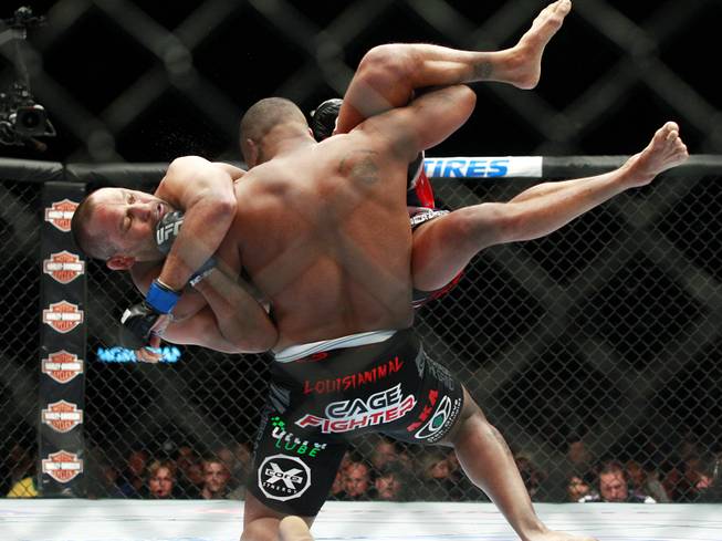 Daniel Cormier throws Dan Henderson during their fight at UFC 173 Saturday, May 24, 2014 at the MGM Grand Garden Arena. Cormier won with a rear naked choke in the third round.