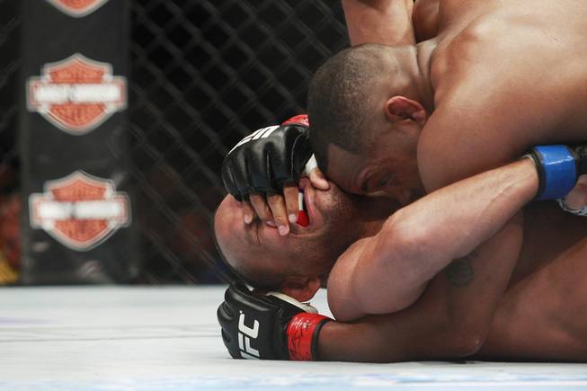 Daniel Cormier controls Dan Henderson on the ground during their fight at UFC 173 Saturday, May 24, 2014 at the MGM Grand Garden Arena. Cormier won with a rear naked choke in the third round.