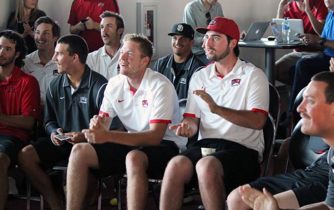 Members of UNLV's baseball team react to seeing their team make the NCAA Tournament field at a watch party at the Mendenhall Center on Monday, May 26, 2014. It's their first trip to a regional since 2005.