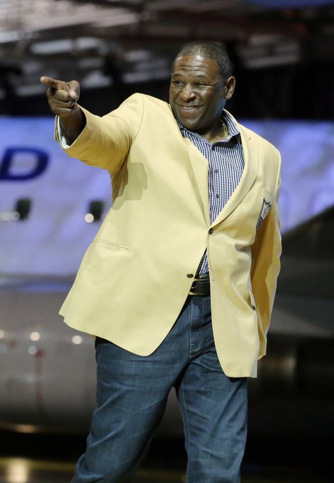 In this May 2, 2014, file photo, Jackie Slater is introduced before the inaugural Pro Football Hall of Fame Fan Fest at the International Exposition Center in Cleveland. Years before Jackie Slater was an NFL Hall of Fame offensive lineman, he was a gigantic teenager in Jackson, Mississippi, playing football for Wingfield High School and hoping to attract the attention of college scouts.