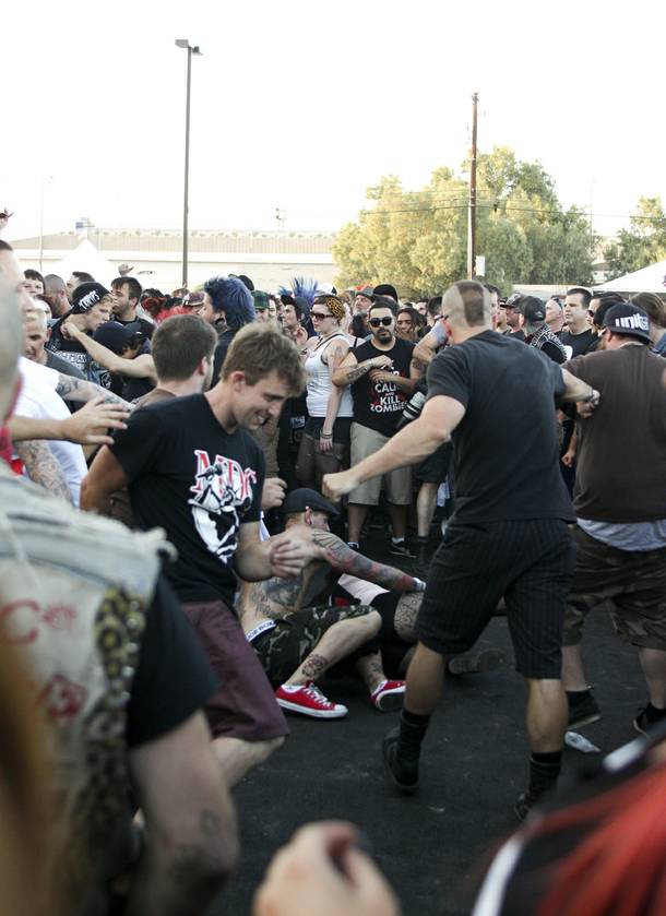 Festival goers join the mosh pit at the Punk Rock Bowling & Music Festival Sunday, May 25, 2014.