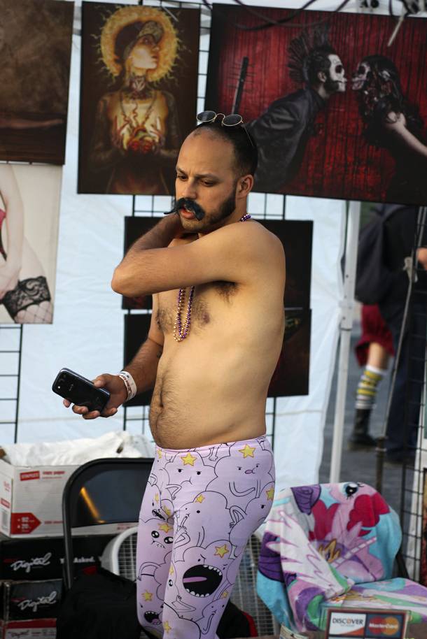 A vendor sells art at the Punk Rock Bowling & Music Festival Sunday, May 25, 2014.