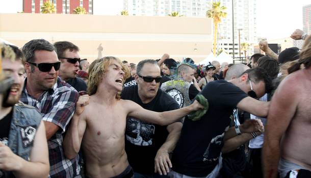 Festival goers take part in the mosh pit during SNFU's set at the Punk Rock Bowling & Music Festival Sunday, May 25, 2014.