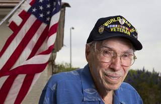 World War II veteran Davis B. Leonard poses at his home in Henderson Wednesday, May 28, 2014. Leonard and Gaetano 
