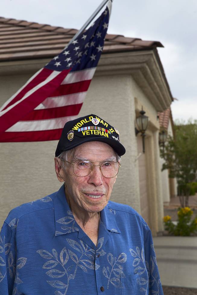 World War II veteran Davis B. Leonard poses at his home in Henderson Wednesday, May 28, 2014. Leonard and Gaetano "Guy" Benza, another local World War II veteran, will receive the French Legion d'Honneur award on Friday. The award is the highest honor France bestows on its citizens and foreign nationals.