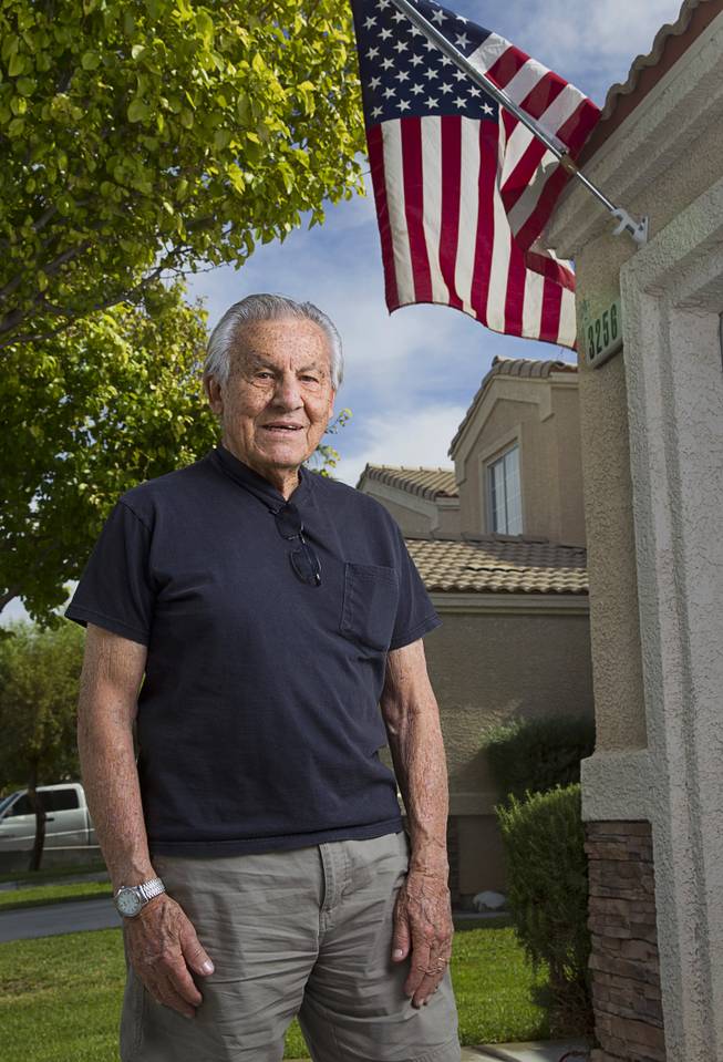 World War II veteran Gaetano "Guy" Benza poses outside his home in North Las Vegas Wednesday, May 28, 2014. Benza and Davis Leonard, another local World War II veteran, will receive the French Legion d'Honneur award on Friday. The award is the highest honor France bestows on its citizens and foreign nationals.