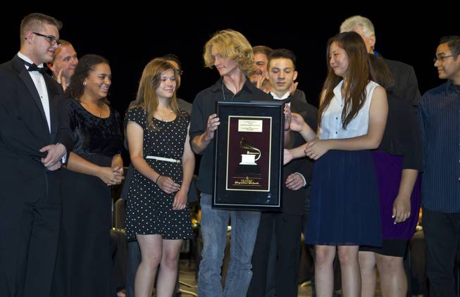 Las Vegas Academy of the Arts students hold their GRAMMY Signature Schools Gold Award during the presentation for achieving GRAMMY Signature Schools Gold status on Wednesday, May 28, 2014.