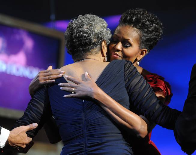 First lady Michelle Obama hugs BET Honoree Maya Angelou on the BET Honors 2012 at the Warner Theatre, January 14, 2012 in Washington, DC. The BET Honors 2012 will premiere on Monday, February 13, at 9:00 PM on BET.