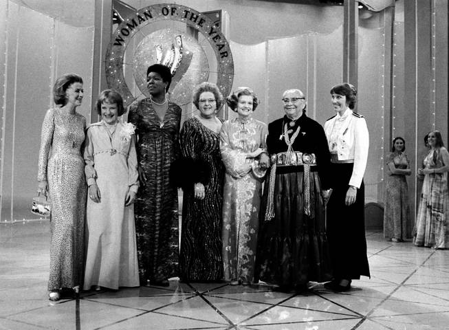 U.S. first lady Betty Ford, third from right, poses with six other women who took part in the taping of the television special presentation of Ladies' Home Journal "Woman of the Year 1976" in New York City, Thursday, April 8, 1976. From left are, Betty Furness, Bettye Caldwell, Maya Angelou, singer Kate Smith, Ford, Dr. Annie D. Wauneka and Micki King.