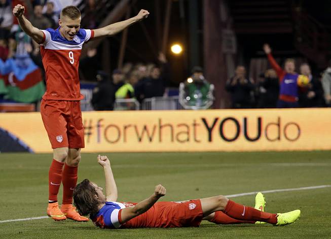 United States' Mix Diskerud, bottom, celebrates his goal with teammate Aron Johannsson, left, during the second half of an international friendly soccer match against Azerbaijan on Tuesday, May 27, 2014, in San Francisco. United States won 2-0. 