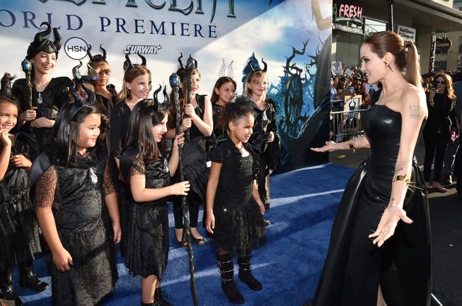 Angelina Jolie arrives at the world premiere of "Maleficent" at the El Capitan Theatre on Wednesday, May 28, 2014, in Los Angeles. 