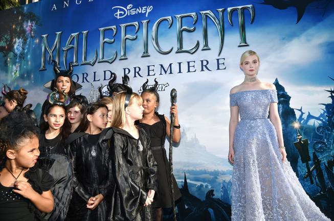 Elle Fanning arrives at the world premiere of "Maleficent" at the El Capitan Theatre on Wednesday, May 28, 2014, in Los Angeles. 