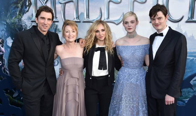 Sharlto Copley, and from left, Lesley Manville, Juno Temple, Elle Fanning and Sam Riley arrive at the world premiere of "Maleficent" at the El Capitan Theatre on Wednesday, May 28, 2014, in Los Angeles. 