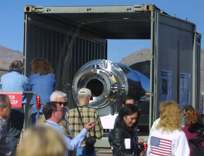 Members of the public mill around a NAC-LWT Transportation Cask as it sits on view in its truck during a public open house of the Yucca Mountain Project Saturday, November 3, 2001.  This is a cask that has been approved by the Nuclear Regulatory Commission for carrying spent nuclear fuel and waste to Yucca Mountain.