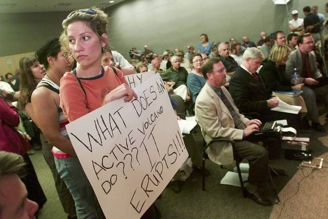 A protestor holds a sign during the Department of Energy's public hearing on the proposed Yucca Mountain Repository Sept. 5, 2001.