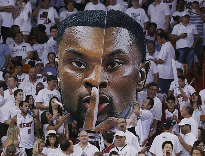 Miami Heat fans display a large cutout of Indiana Pacers guard Lance Stephenson during the first half Game 6 in the NBA basketball playoffs Eastern Conference finals on Friday, May 30, 2014, in Miami. 