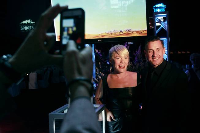 Carey Hart and his wife Alecia Beth Moore Hart, better known as the pop singer Pink, pose for photos during the induction for the Southern Nevada Sports Hall of Fame Friday, May 30, 2014.