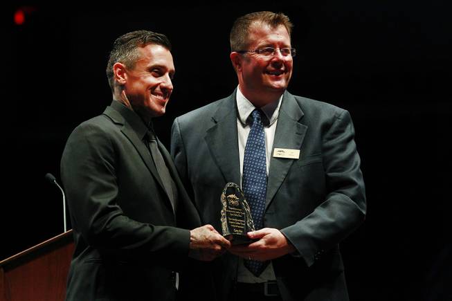 Carey Hart and Southern Nevada Sports Hall of Fame chairman Jeff Motley pose for photos after Hart's induction into the Southern Nevada Sports Hall of Fame Friday, May 30, 2014.