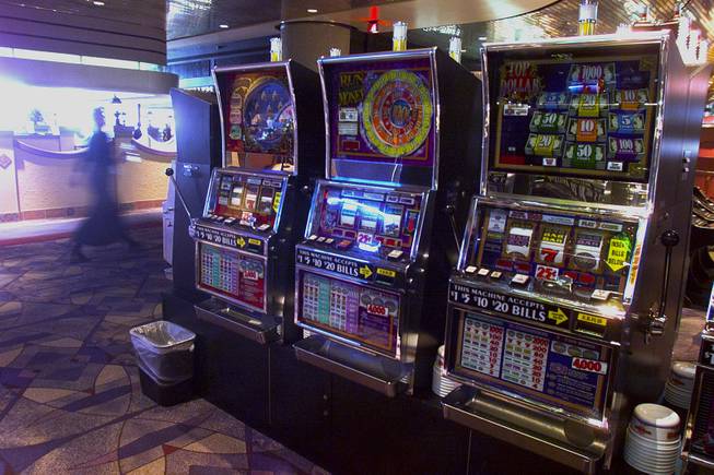 Slot machines are shown turned off at McCarran International Airport Tuesday, Sept. 11, 2001.