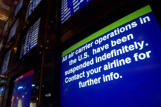A display at McCarran International Airport carries a message about the suspension of domestic air travel Tuesday, Sept. 11, 2001.