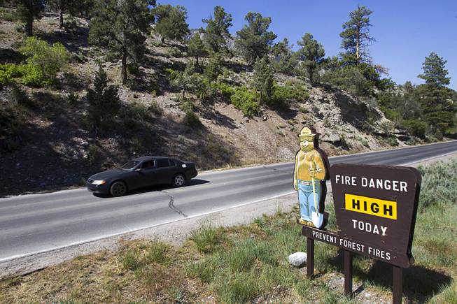 A signs lists the fire danger level on Mt. Charleston Tuesday, May 27, 2014. The mountain is showing signs of recovery, about one year after the Carpenter 1 Fire that scorched almost 28,000 acres in 2013.