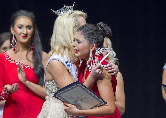 Ellie Smith, right, of Henderson gets a hug by 2013 Miss Nevada Diana Sweeney after being named 2014 Miss Nevada at the Miss Nevada and Miss Nevada Outstanding Teen Pageant at the Las Vegas Academy Theater Sunday, June 1, 2014. Her sister Amy Smith was crowned 2014 Miss Nevada Outstanding Teen.