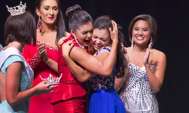 Ellie Smith, left, gives a hug to her sister Amy Smith after Amy was named Miss Nevada’s Outstanding Teen at the Las Vegas Academy of the Arts Theater on Sunday, June 1, 2014. Ellie Smith was later crowned 2014 Miss Nevada.