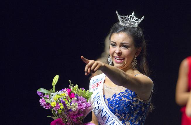 Amy Smith points to someone in the audience after being crowned Miss Nevada Outstanding Teen at the Miss Nevada and Miss Nevada Outstanding Teen Pageant at the Las Vegas Academy Theater Sunday, June 1, 2014. Her sister Ellie Smith later won 2014 Miss Nevada.