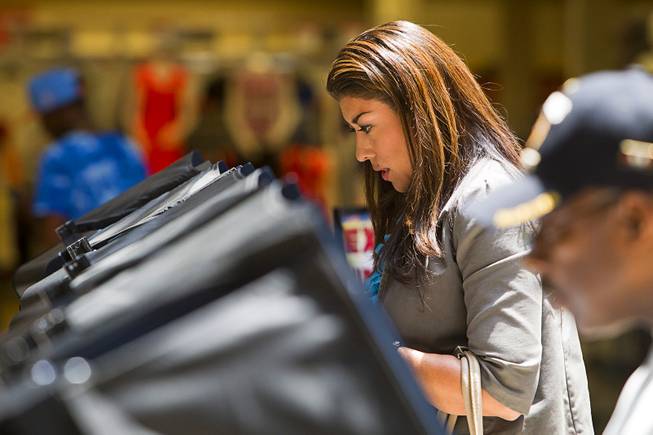 Lucy Flores, Democratic candidate for Lieutenant Governor, votes at the Meadows Mall Monday, June 2, 2014. Early voting for the 2014 primary election continues through Friday June 6 at 83 sites.