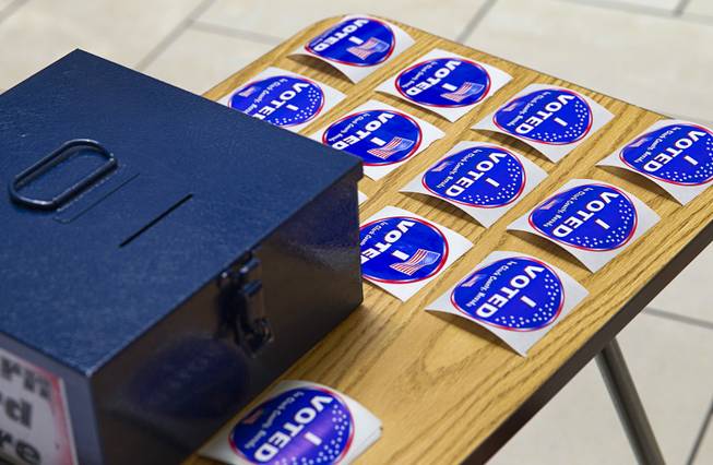Stickers are arranged on a table during early voting at Meadows Mall on Monday, June 2, 2014. Early voting for the 2014 primary election continues through Friday, June 6, at 83 sites.
