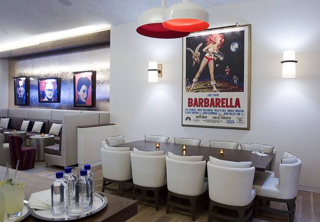 A dining area is shown during the VIP grand opening of Giada, the first Giada De Laurentiis restaurant, on Monday, June 2, 2014, in the Cromwell. The movie poster on the wall is a nod to her grandfather Agostino "Dino" De Laurentiis, who produced "Barbarella," a 1968 film starring Jane Fonda.