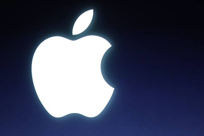 In this Tuesday, Oct. 4, 2011, file photo, an Apple logo is seen during an announcement at Apple headquarters in Cupertino, Calif.