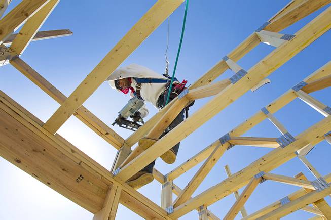 A carpenter works on a KB Homes project at Inspirada in Henderson Tuesday, June 3, 2014. 